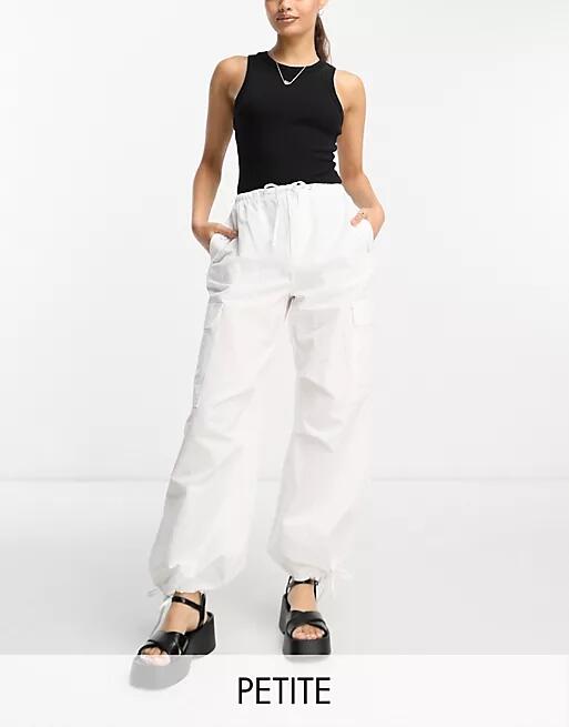 Bershka Petite tie waist nylon cargo parachute pants in white Cover