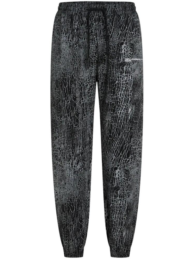 Karl Lagerfeld Jeans embroidered cracked-print track pants - Black Cover