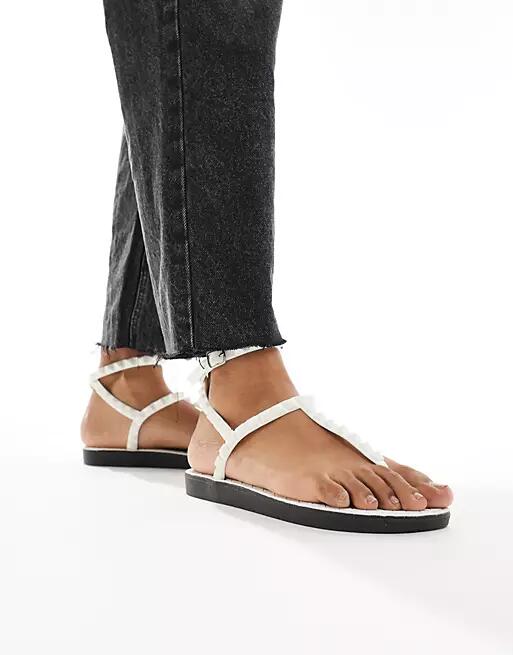 London Rebel studded t-bar ankle strap jelly sandals in white Cover