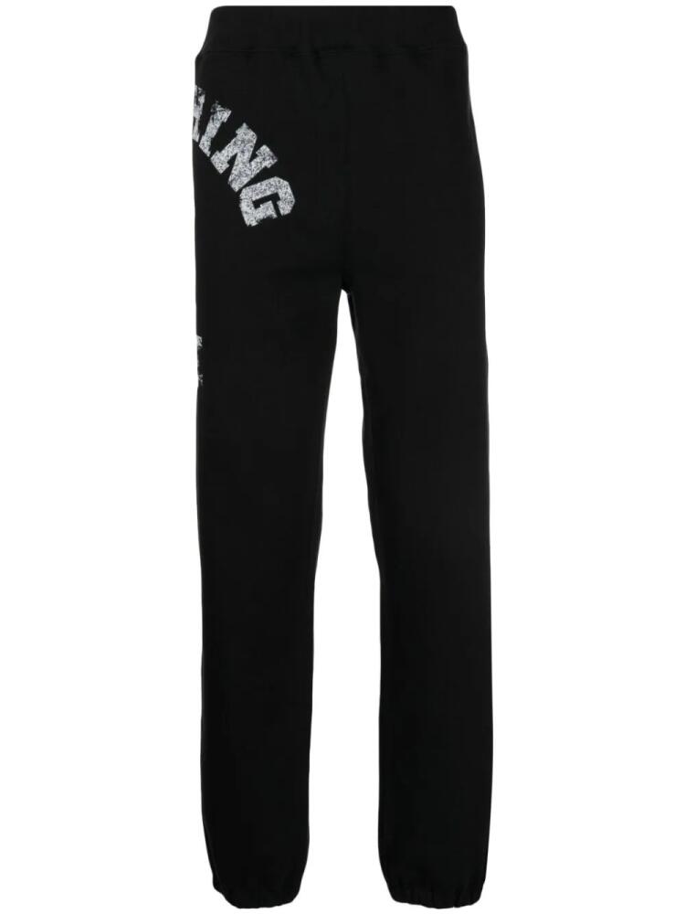 A BATHING APE® logo-print jersey track pants - Black Cover