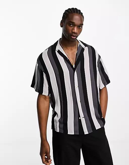 ADPT oversized shirt in black with tonal stripes Cover