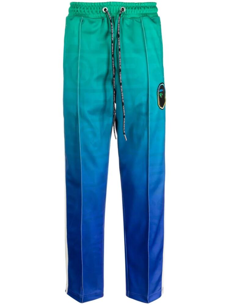 A BATHING APE® logo-patch ombré-effect track pants - Green Cover