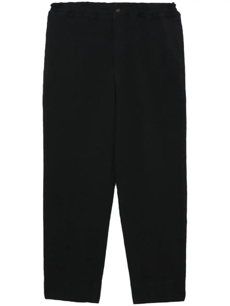 Black Comme Des Garçons cropped elasticated trousers Cover