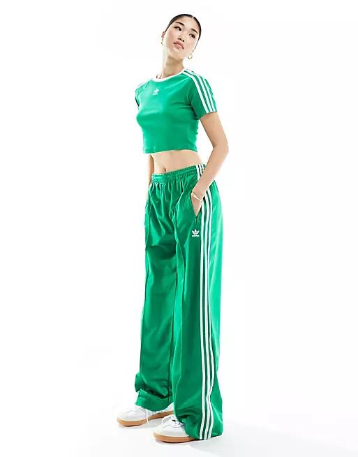 adidas Originals adicolor firebird track pants in green Cover