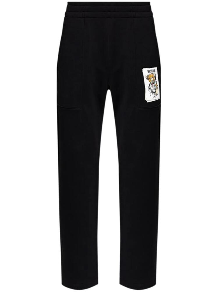 Moschino patch-detailed track pants - Black Cover