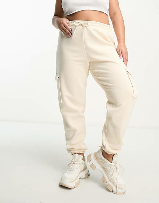 River Island Plus cargo pants with pocket detail in beige-Neutral Cover