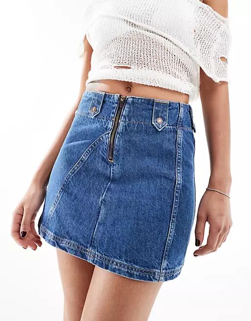 Free People denim a-line mini skirt in mid wash blue Cover