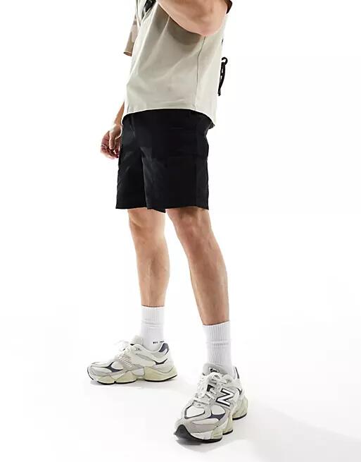 Another Influence cotton twill cargo shorts in black Cover