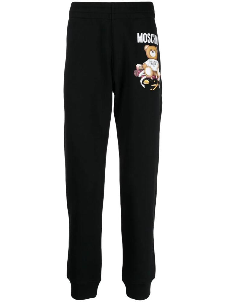 Moschino Teddy Bear-print cotton track pants - Black Cover