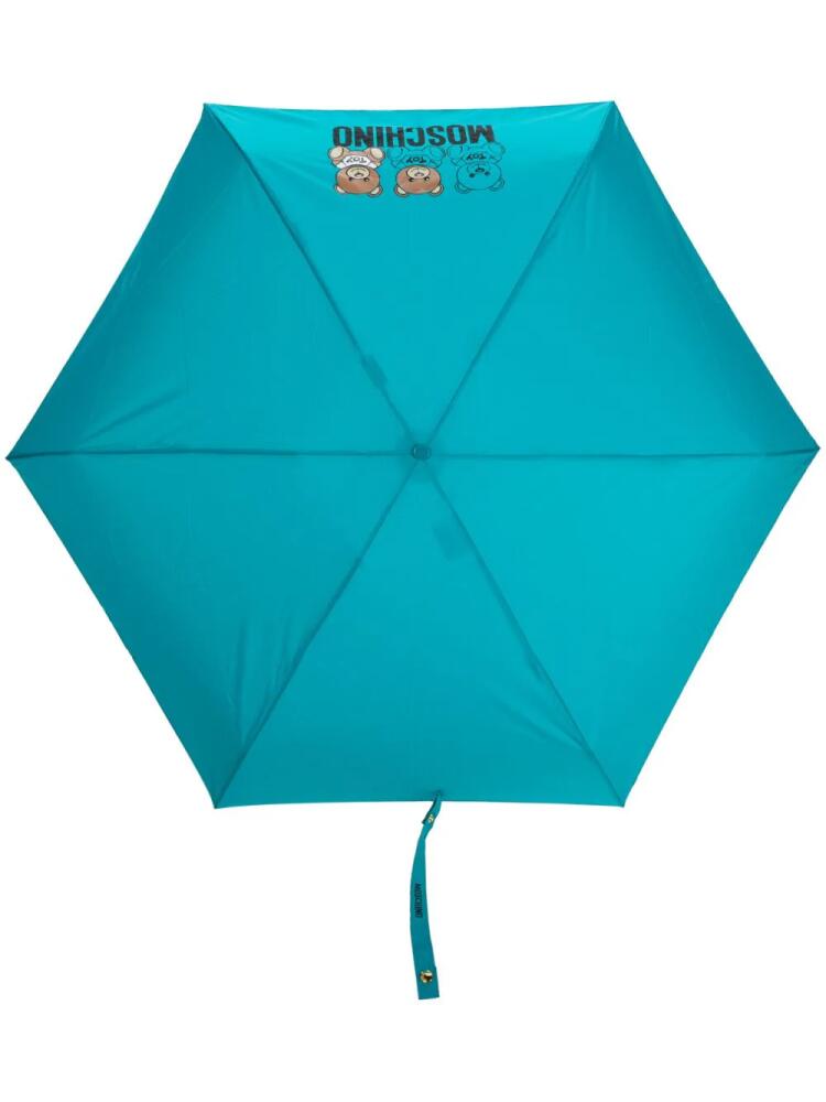 Moschino logo-print compact umbrella - Blue Cover