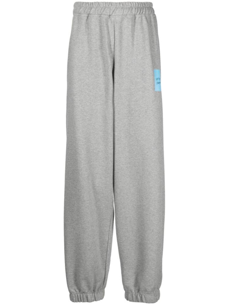 VETEMENTS logo-print wide-leg track pants - Grey Cover