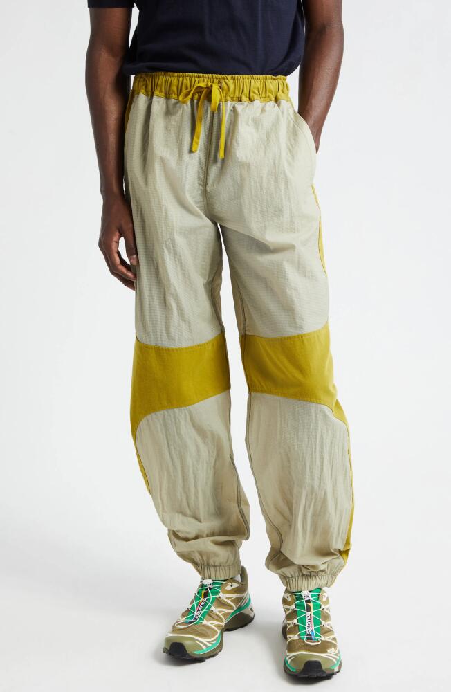 RANRA Is Colorblock Track Pants in Khaki Grey Cover