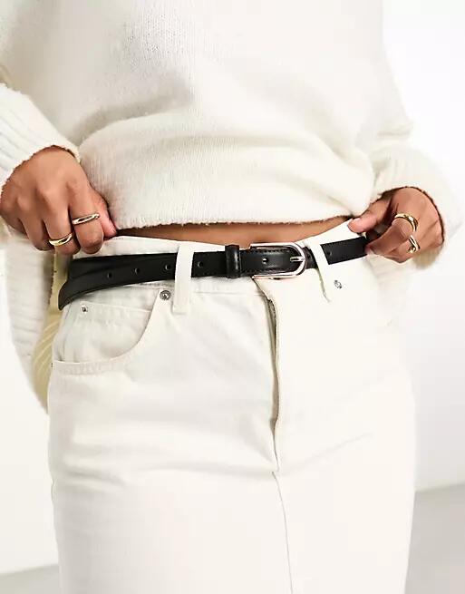 ASOS DESIGN skinny waist and hip jeans belt with gold buckle in black Cover