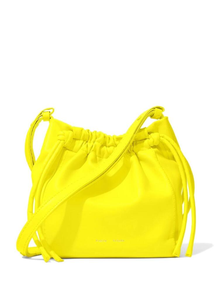 Proenza Schouler engraved-logo drawstring crossbody bag - Yellow Cover