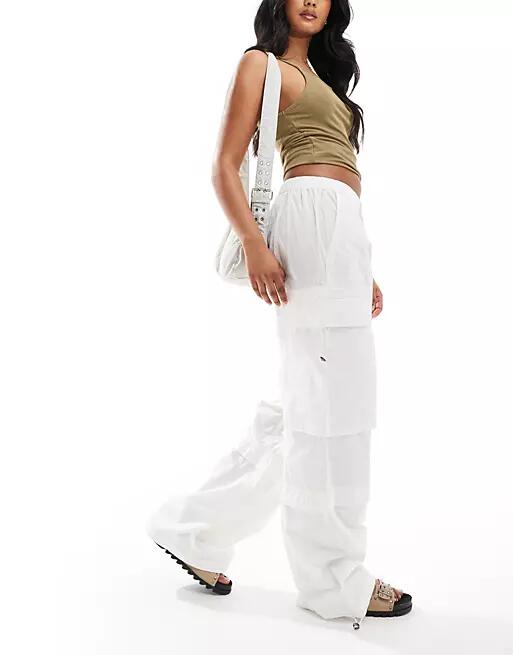 AllSaints Barbara cargo parachute pants in white Cover