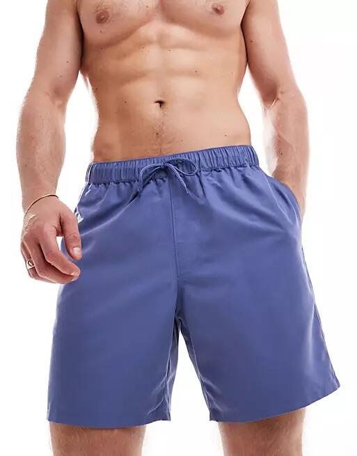 ASOS DESIGN swim shorts in mid length in blue Cover