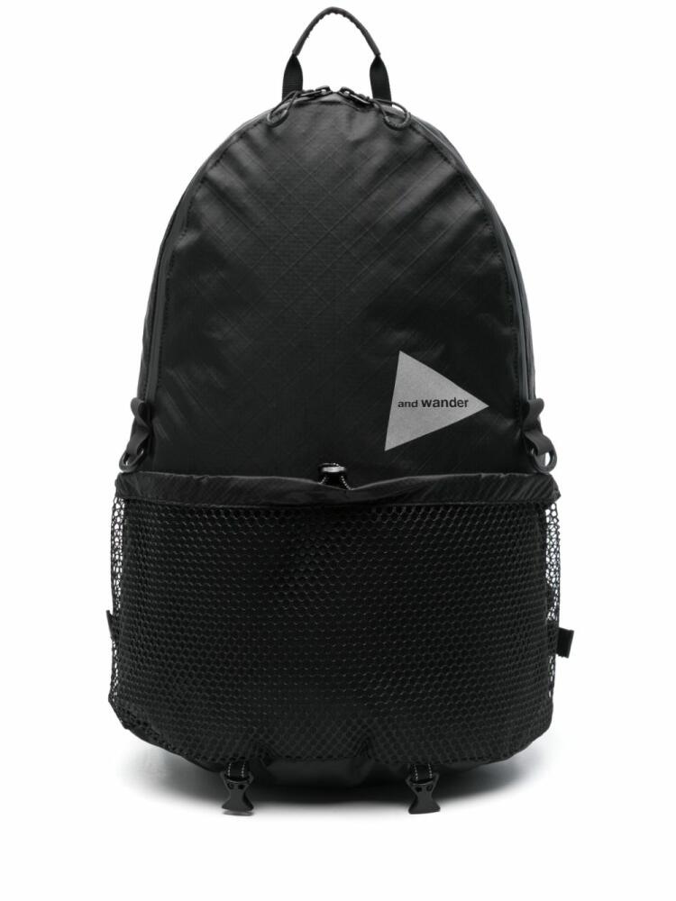 and Wander logo-print backpack - Black Cover