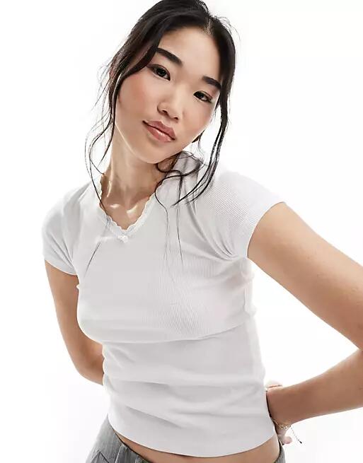 Cotton On v-neck fitted T-shirt with rosette detail in white Cover