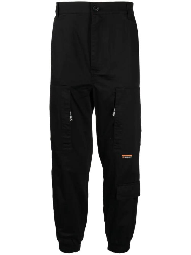 izzue tapered-leg cotton trousers - Black Cover