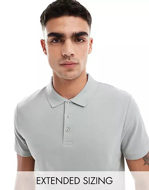 ASOS DESIGN pique polo shirt in washed green Cover