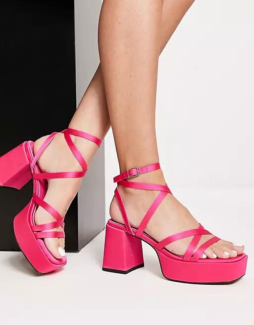 ASOS DESIGN Hutton strappy platform heeled sandals in pink Cover