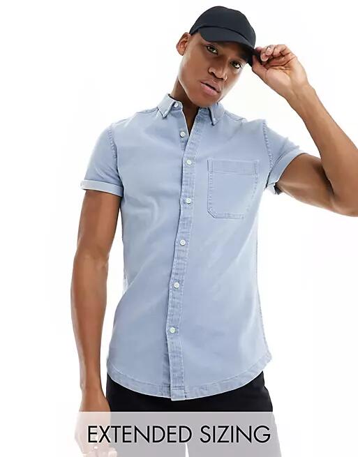 ASOS DESIGN slim roll sleeve denim shirt with button down collar in light blue wash Cover