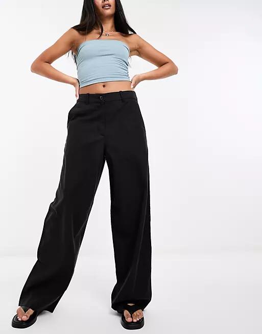 Weekday Elio baggy fit pants in washed black Cover