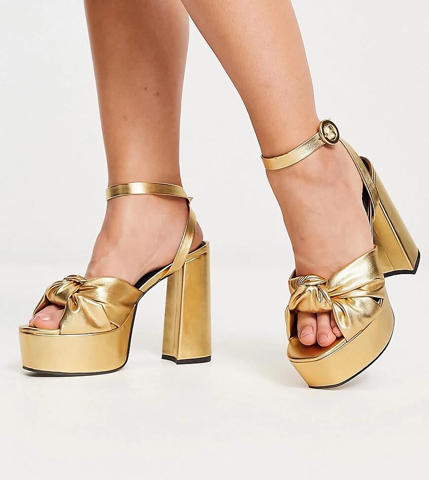 ASOS DESIGN Wide Fit Natia knotted platform heeled sandals in gold Cover