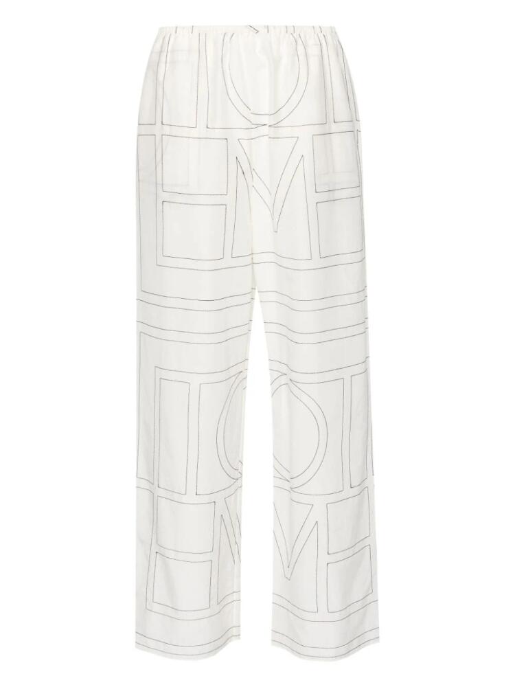 TOTEME embroidered-monogram trousers - White Cover