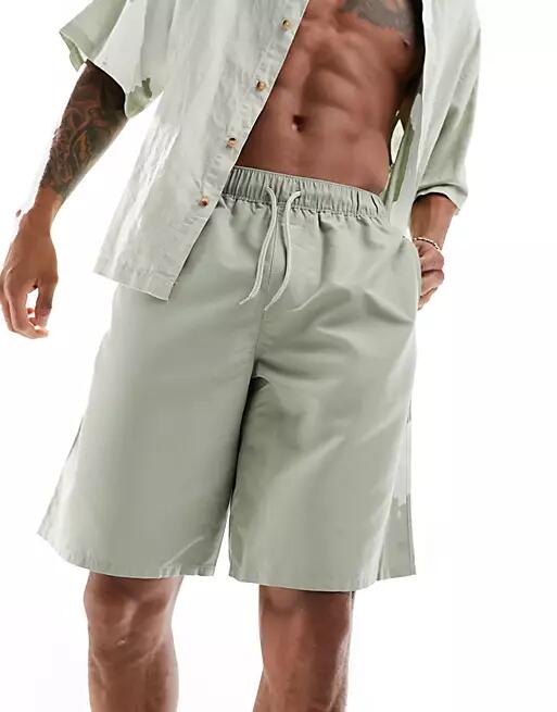 ASOS DESIGN swim shorts in long length in light khaki-Green Cover