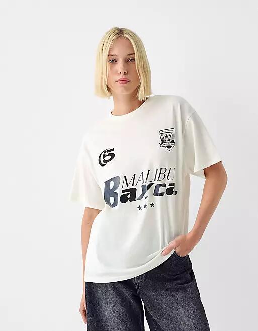 Bershka oversized 'Malibu' graphic football tee in ecru-Multi Cover