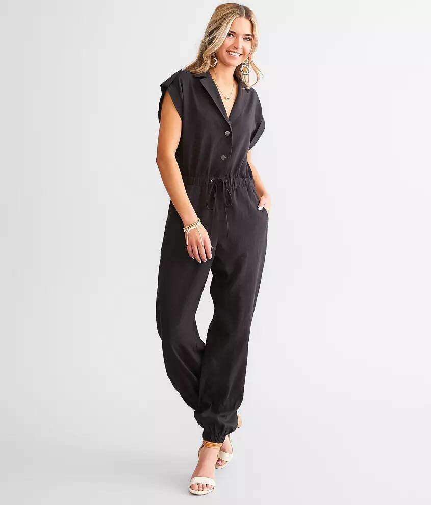 A. Peach Solid Boiler Jumpsuit Cover