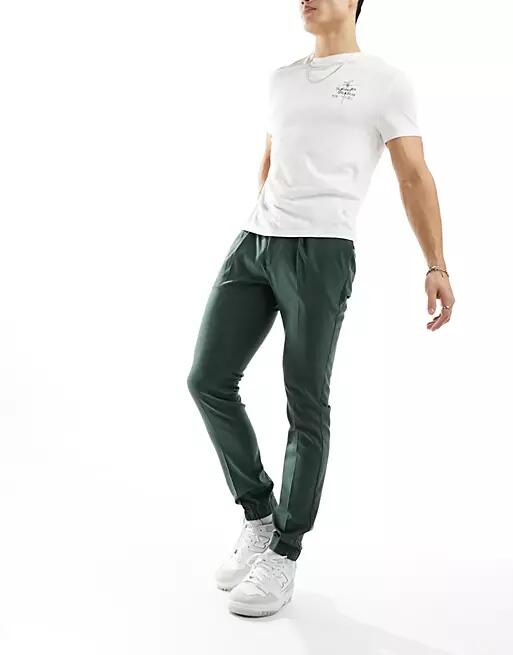 ASOS DESIGN smart skinny sweatpants in green Cover