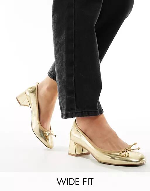 ASOS DESIGN Wide Fit Steffie bow detail mid block heeled shoes in gold Cover