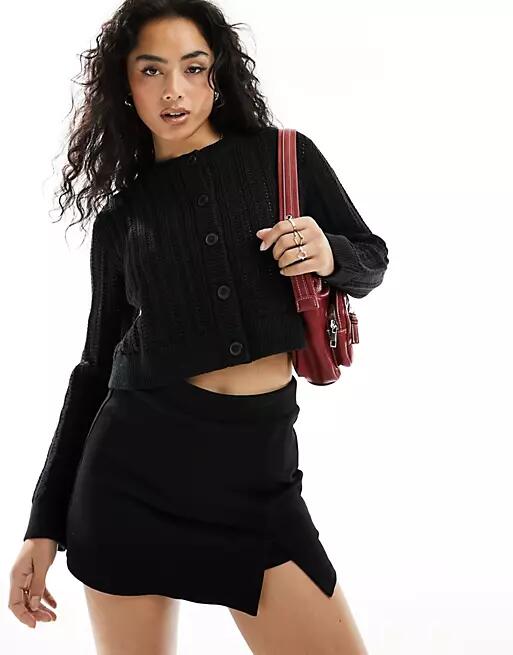 ASOS DESIGN cropped crew neck cardigan in open stitch in black Cover