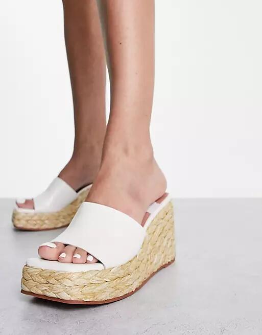 ASOS DESIGN Teo wedge mules in white Cover