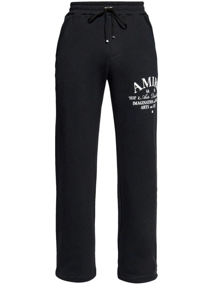 AMIRI logo-print cotton track pants - Black Cover