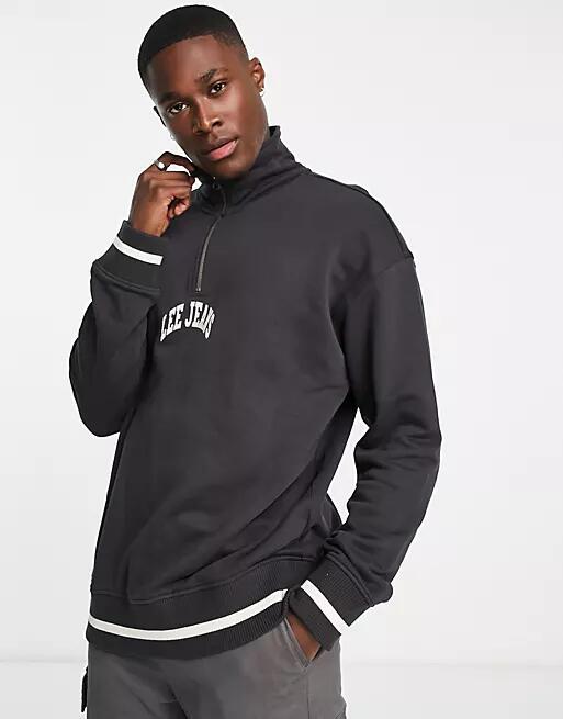 Lee varsity central logo loose fit half zip sweatshirt in washed black Cover