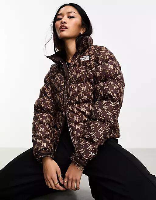 The North Face 1996 Retro Nuptse down puffer jacket with monogram print in brown Cover