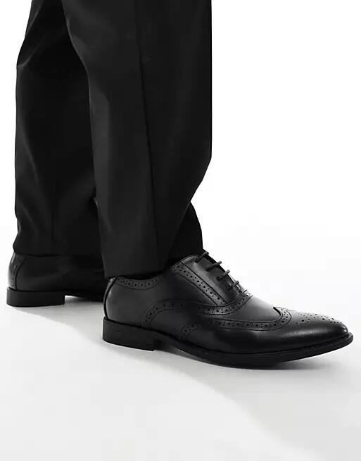 ASOS DESIGN faux leather brogue shoes in black Cover