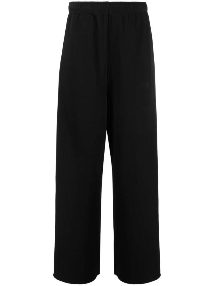 MM6 Maison Margiela numbers motif-embroidered cotton track trousers - Black Cover