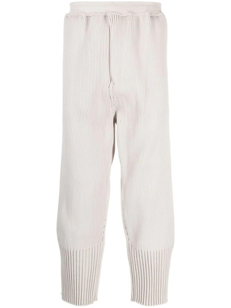 CFCL fully-pleated tapered track pants - Neutrals Cover