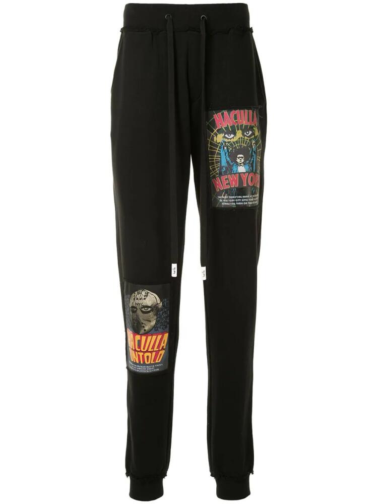 Haculla movie poster print track trousers - Black Cover