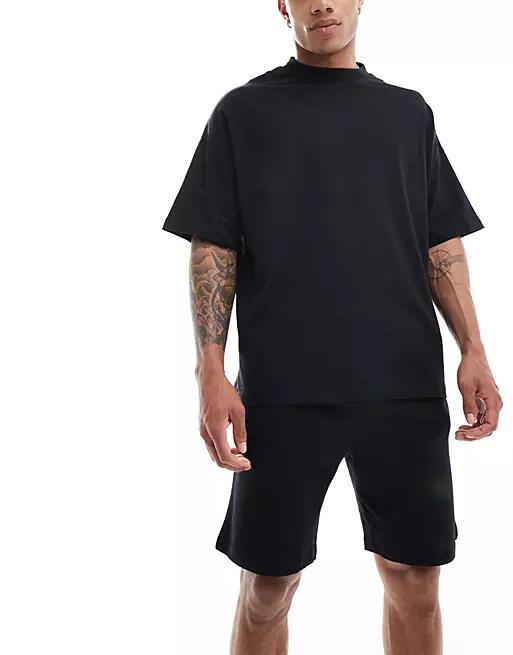 ASOS DESIGN pajama set with oversized t-shirt and shorts in jersey in black Cover