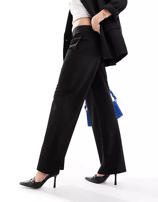 ASOS DESIGN mid rise straight leg pants in black Cover