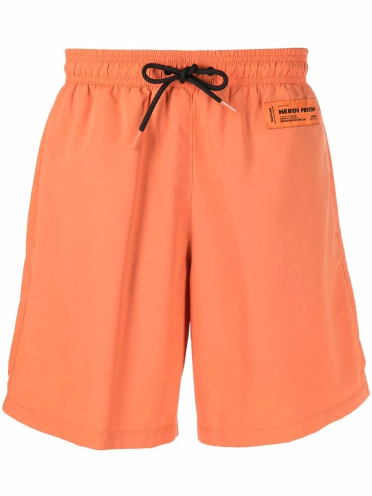 Heron Preston logo-patch swim shorts - Orange Cover