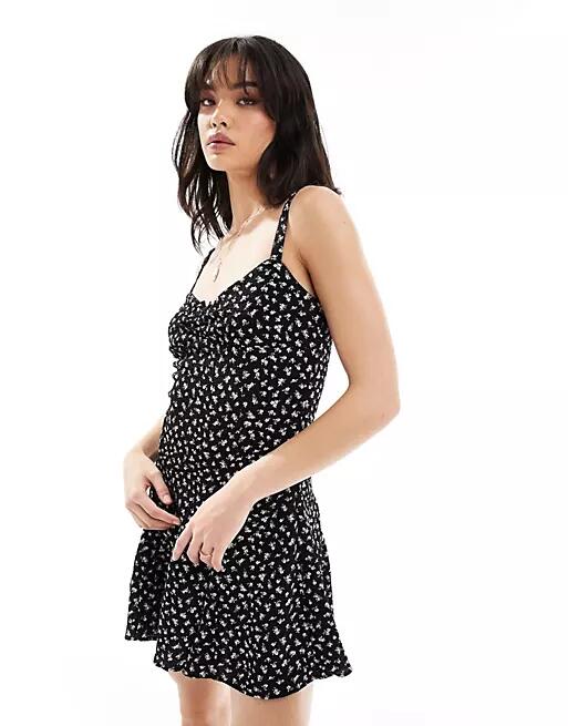 Bershka bow detail mini dress in black and white floral Cover