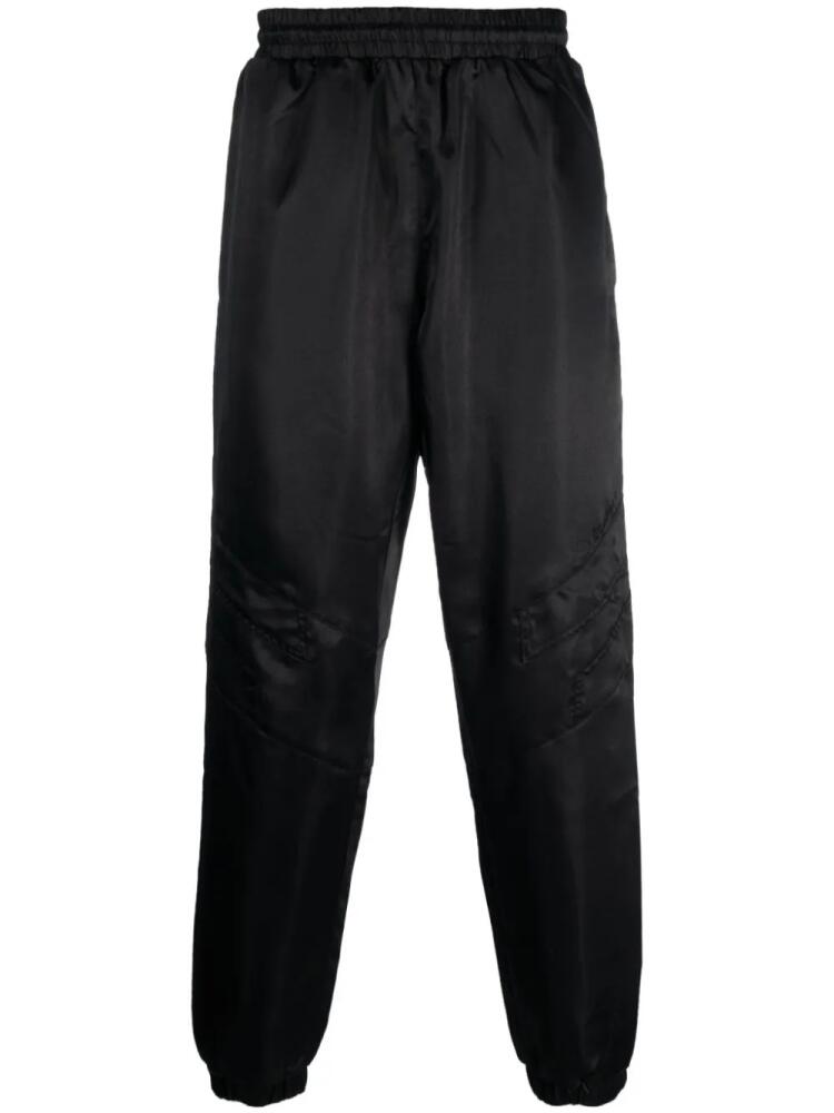 Etudes Tour satin-finish trousers - Black Cover