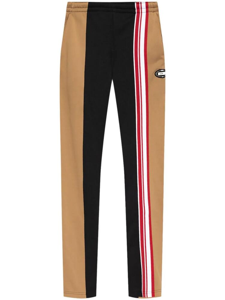 Moschino logo-patch track pants - Neutrals Cover