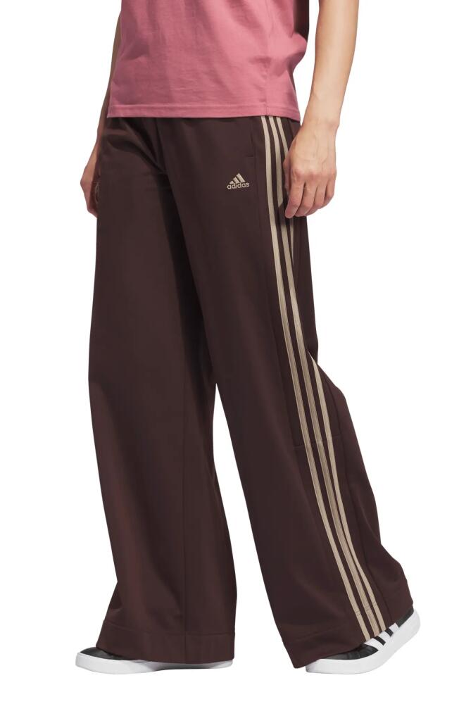 adidas Essentials Recycled Polyester Tricot Wide Leg Track Pants in Shadow Brown/Blanch Cargo Cover